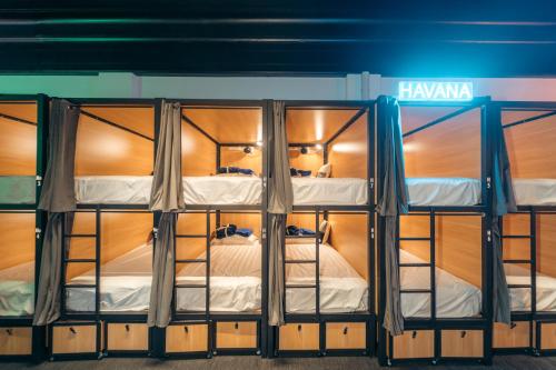 a room with two bunk beds in it at Capsuleaccom Hostel in Gold Coast