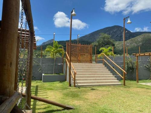 a set of stairs with mountains in the background at Village Jardins in Jacobina