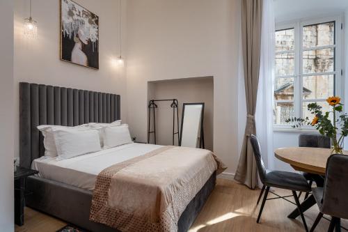 Ένα ή περισσότερα κρεβάτια σε δωμάτιο στο Piano Nobile Residence