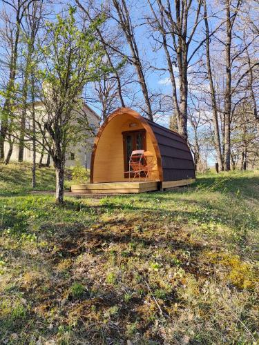 a small tent in the middle of a field at Camping du Moulin de Thoard in Thoard