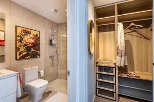 a bathroom with a toilet and a shower at Malaga Skyline 4 Pool & Parking Free in Málaga