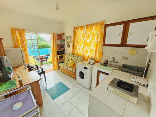 Kuchyň nebo kuchyňský kout v ubytování Tropical Apartment