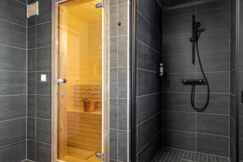 a bathroom with a shower and a walk in shower at Nesfjellet in Nes i Ådal