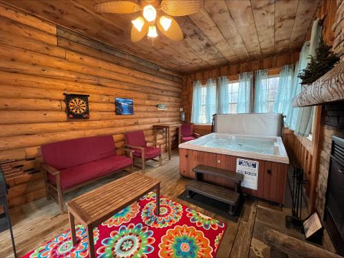 a living room with a hot tub in a log cabin at Evergreen in Oakland
