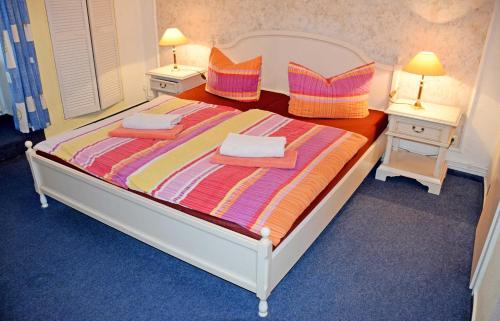 a bedroom with a large bed with two night stands at Villa im Ostseebad Baabe in Baabe
