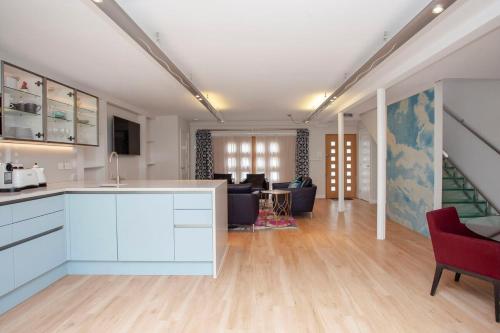 an open kitchen and living room in a building at ※ Spacious Georgian Coach House & with Parking (TCH) ※ in Bath