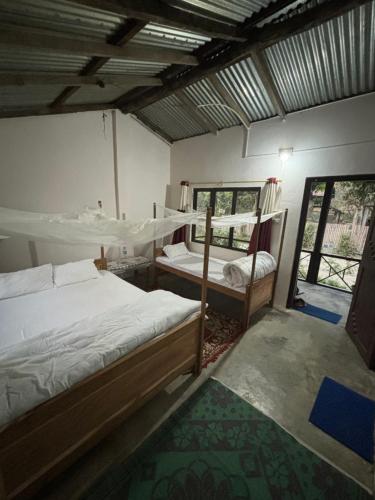 Postel nebo postele na pokoji v ubytování Nanu's Bardiya Homestay