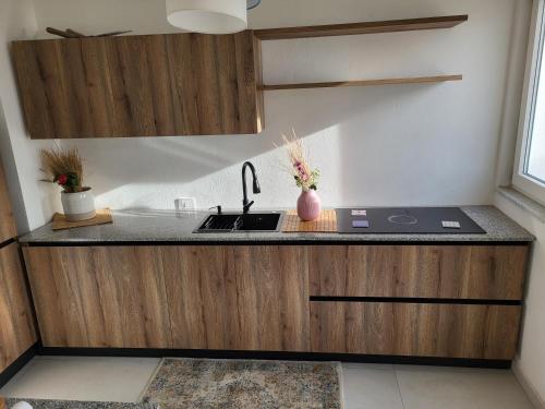 a kitchen with a sink and a counter at Il Panorama di Ercole in Monte di Procida