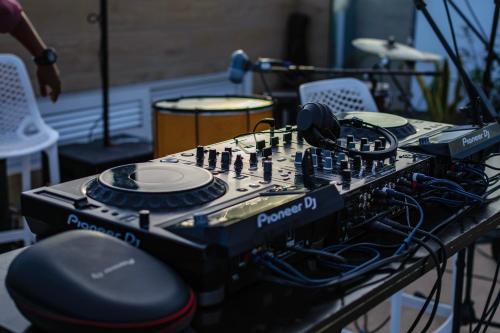 a recording studio with a mixing board with headphones on it at Ouril Mindelo in Mindelo