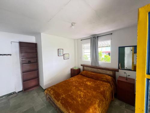 Postel nebo postele na pokoji v ubytování Hostal Las Hamacas del Bosque