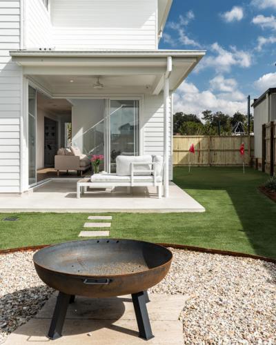 a fire pit in the backyard of a house at Cream Elegance Brand new Luxury 5BR Ex Display Home in Bahrs Scrub