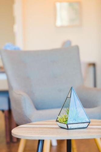 a wooden table with a sail boat on top of it at Central Location 1BR APT w City view South BNE in Brisbane