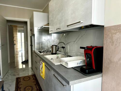 a kitchen with a sink and a counter top at Casa Mare in Rapallo