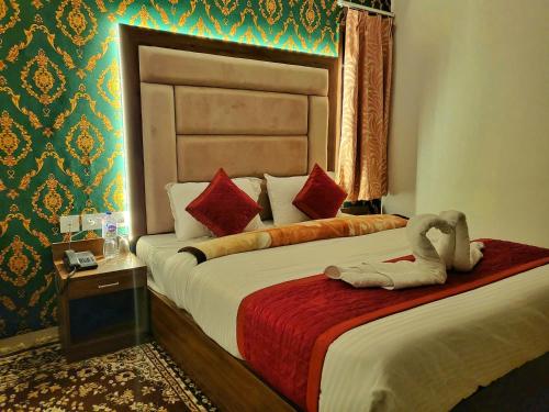 Postel nebo postele na pokoji v ubytování Bay Leaf By Live Inn