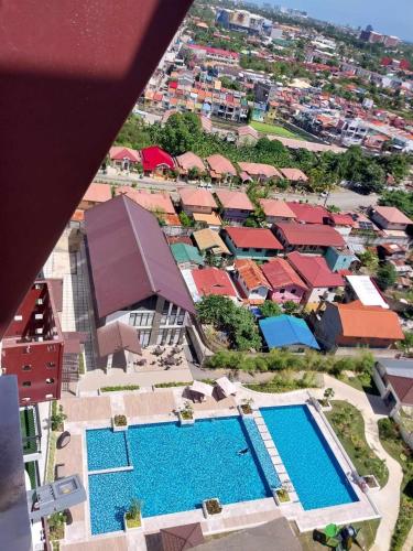 an overhead view of a resort with two swimming pools at Kazumi Suites in Sudtungan