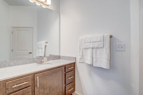 a bathroom with a sink and a mirror at Landing at San Marco Promenade - 1 Bedroom in San Marco in Jacksonville