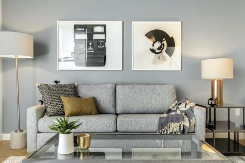 a living room with a couch and a coffee table at Landing at Logan Apartments - Studio in Logan Square in Chicago