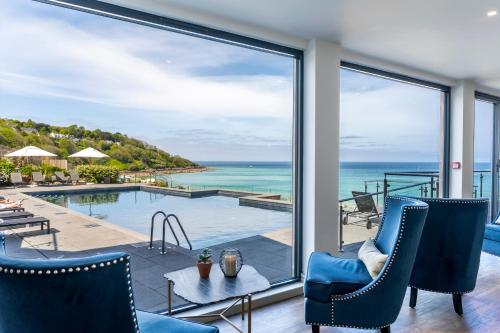 a view of the ocean from the living room of a house at Carbis Bay and Spa Hotel in St Ives