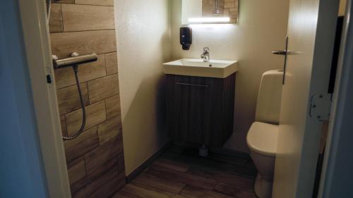 a small bathroom with a sink and a toilet at B&B by the Sea Hirtshals in Hirtshals