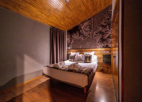 Postel nebo postele na pokoji v ubytování Hotel AnyosPark Mountain & Wellness Resort