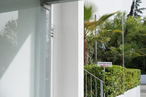 a door to a house with a no entry sign at Local Hostel & Suites in Corfu Town
