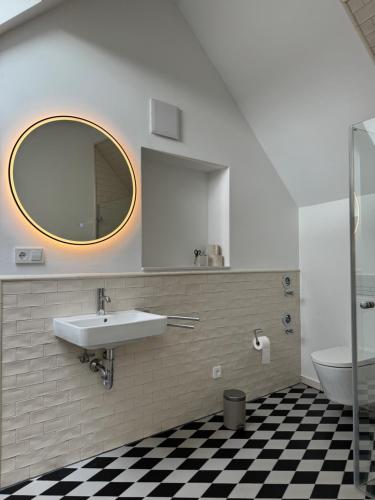 a bathroom with a sink and a mirror at Barkhausstraße in Darmstadt