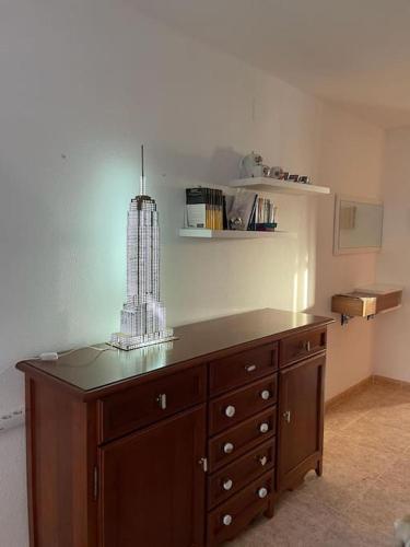 a wooden cabinet with a light on top of it at adosado con piscina en Cabo de Gata 4p in El Cabo de Gata