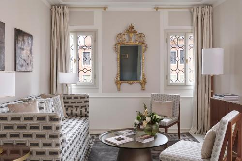 a living room with a couch and a table at Violino d'Oro Venezia in Venice