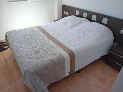 Un ou plusieurs lits dans un hébergement de l'établissement Casa de Verano con Piscina