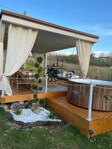 a gazebo with two hot tubs on a deck at La Casina di Sandro in Nocera Umbra