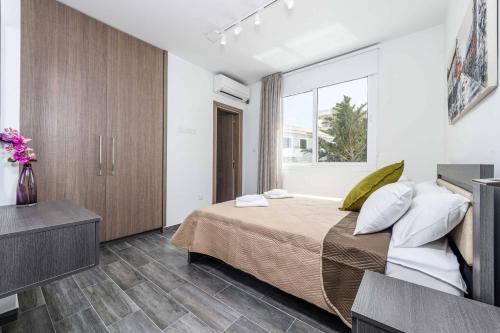 מיטה או מיטות בחדר ב-Green Bay Villa 14