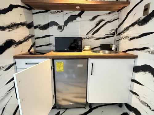 a kitchen with a counter and a sink at Villa Marbella by Potenza Rentals in Santo Domingo