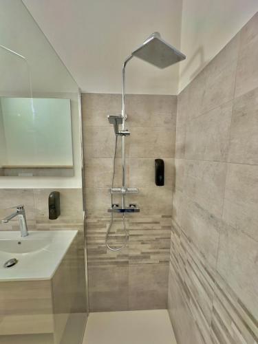 a bathroom with a shower and a sink at Casa del Mare in Bosa