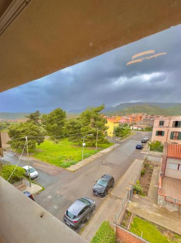 a view of a street with cars parked on the road at Casa del Mare in Bosa