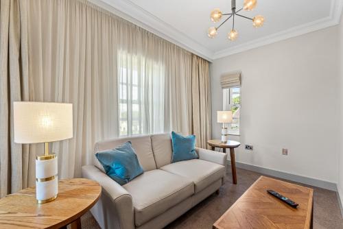 a living room with a couch and a table at Spa Hotel at Ribby Hall Village in Wrea Green