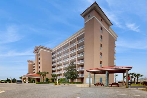 a large building with a clock tower on top of it at The Dunes 704 in Gulf Shores