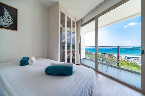Кровать или кровати в номере Oceana Sea View - Kamala Beach