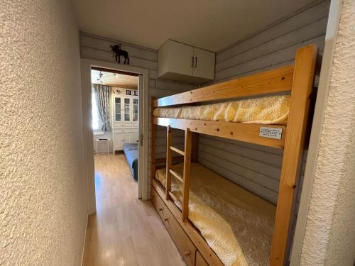 a room with a bunk bed in a house at Appartement cozy aux Gets - Ski-in/Ski-out, proche centre et commodités - FR-1-623-214 in Les Gets