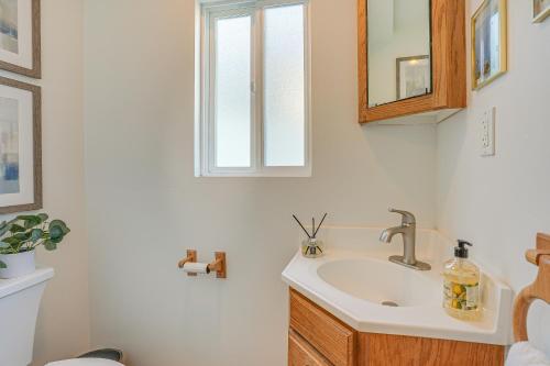 a bathroom with a sink and a mirror at Charming Santa Cruz Studio with Private Hot Tub in Santa Cruz