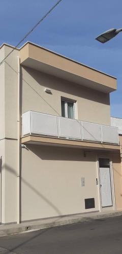 a white balcony on the side of a building at Wanderlust in Sava