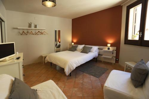 Ένα ή περισσότερα κρεβάτια σε δωμάτιο στο Le Chiavi