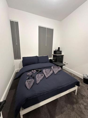 a bedroom with a large bed with pillows on it at Vauxhall Victoria moments away in London