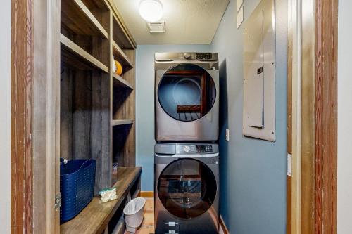 a small kitchen with a washing machine in a room at All-Season Chalet in Park City