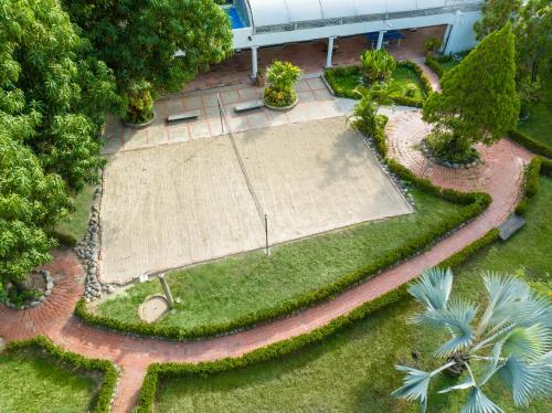an aerial view of a tennis court in a park at GHL Hotel Club el Puente in Girardot