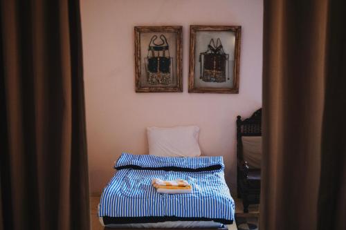 Una cama o camas en una habitación de Alf Leila Boutique Hotel