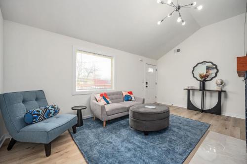 a living room with a couch and a chair at Relax in a Modern Luxury 1BD in Sylvan Hills in Atlanta