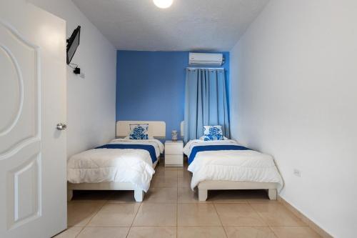 Postel nebo postele na pokoji v ubytování EDMA APARTAHOTEL