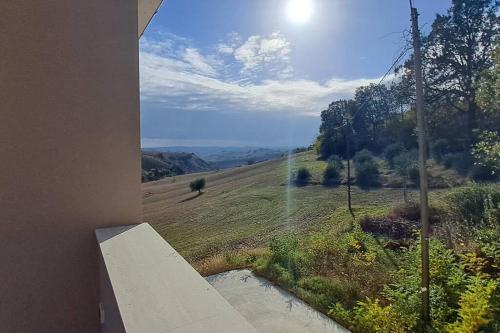 a view of a field from the window of a house at Sweet Home Offida in San Giovanni in Strada