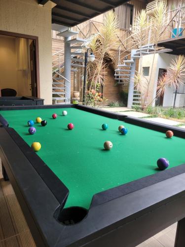 a pool table with balls on top of it at Pousada Recanto do Aconchego in Florianópolis