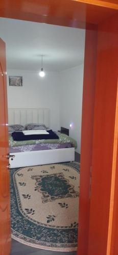 an open door to a bedroom with a bed at Camping SuperPanorama in Kukës